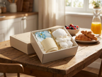 Ivory cream ceramic mug gift set displayed on a sunlit breakfast table with croissants and fresh berries