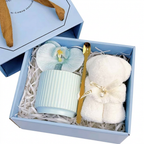 Sky blue ribbed ceramic mug gift set with gold spoon, silk orchid, and teddy bear towel in a Precious Gift box