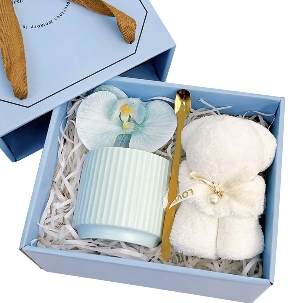 Sky blue ribbed ceramic mug gift set with gold spoon, silk orchid, and teddy bear towel in a Precious Gift box